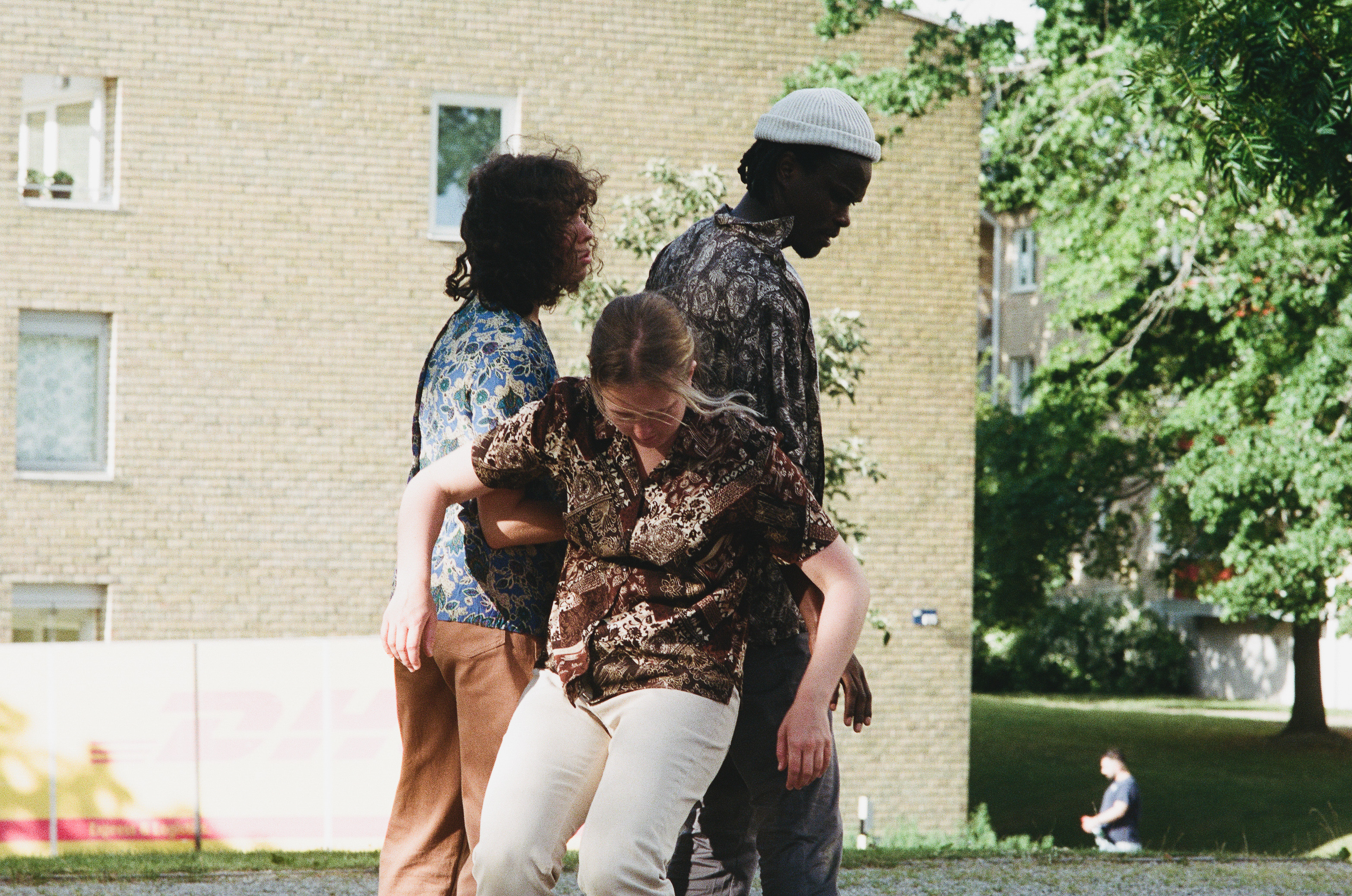 Matilda dancing next to sculpture