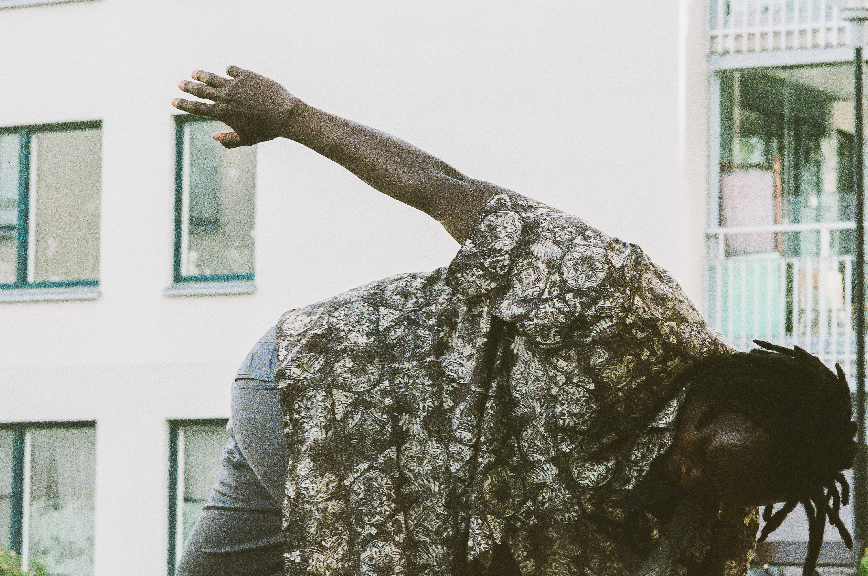 Matilda dancing next to sculpture