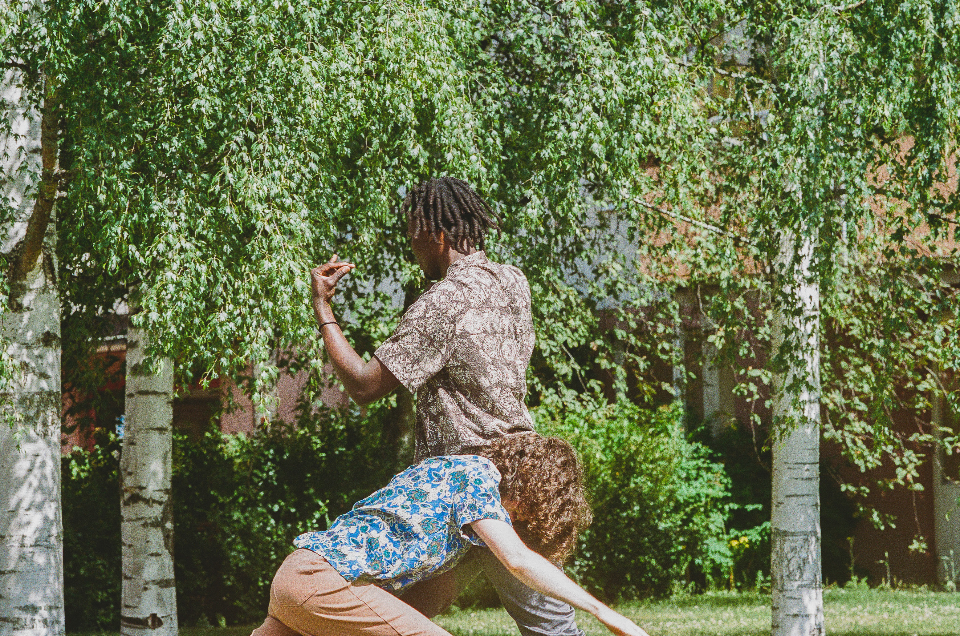 Matilda dancing next to sculpture
