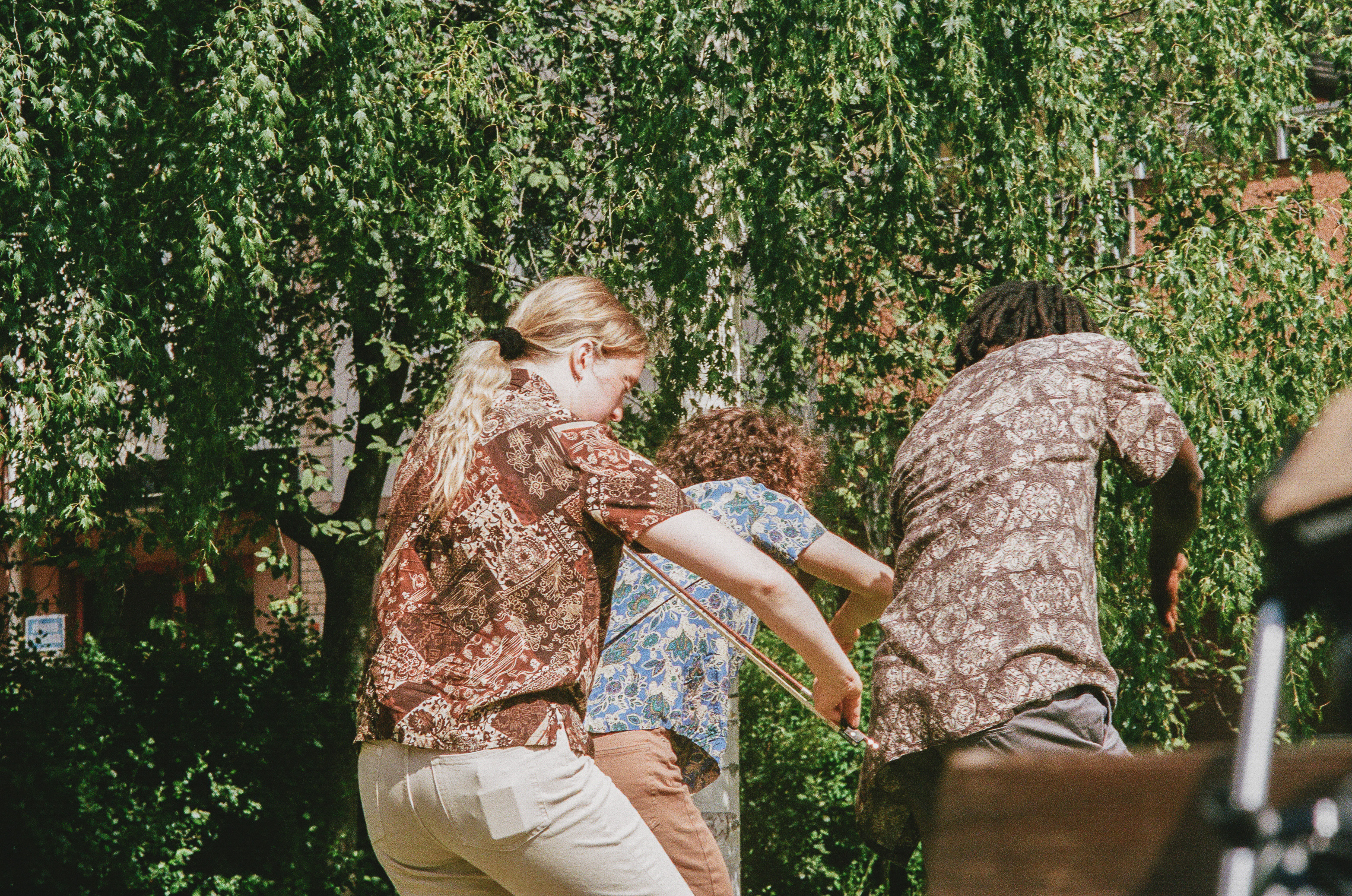 Matilda dancing next to sculpture