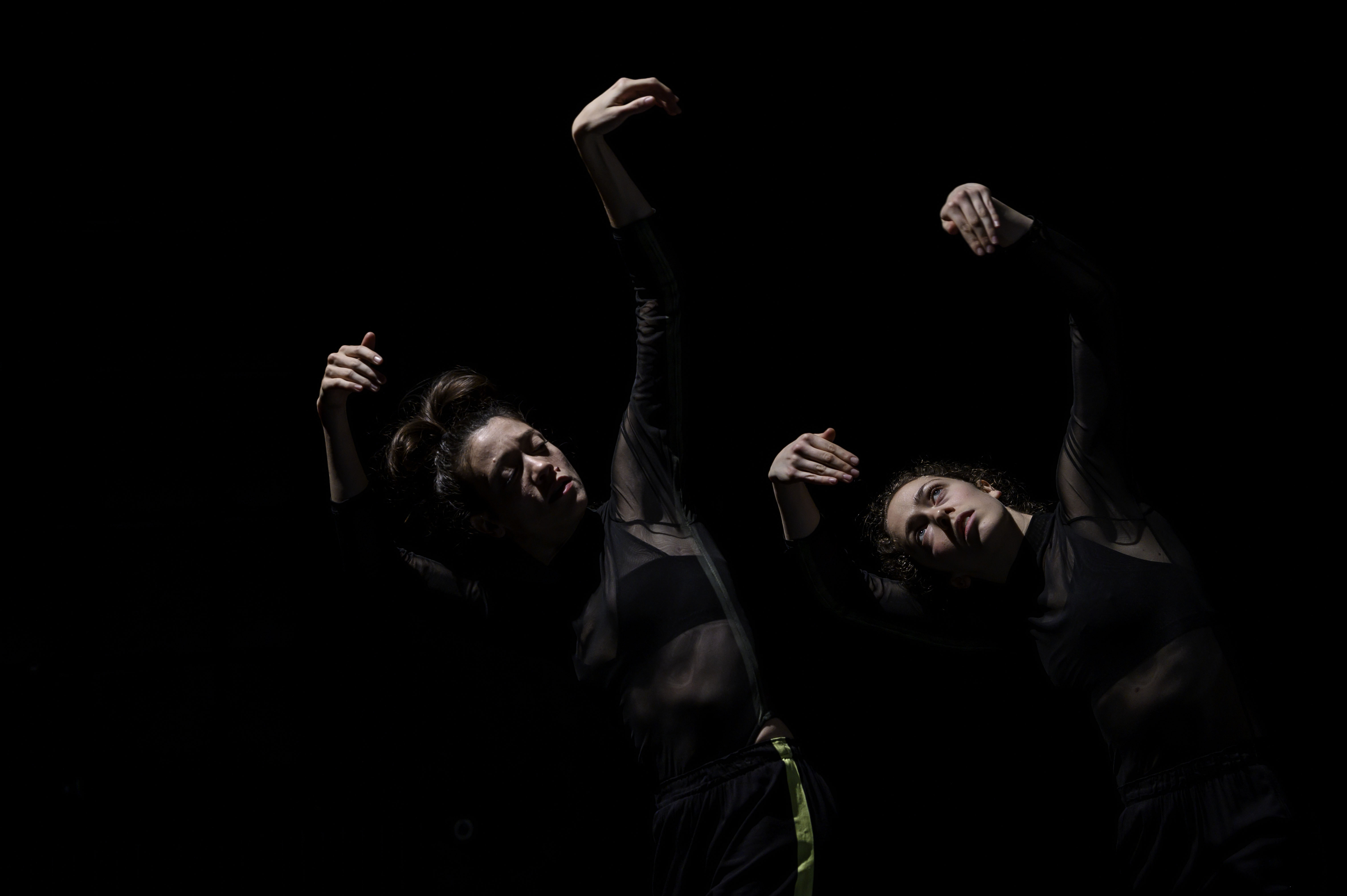 Matilda dancing next to sculpture